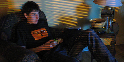 Teen boy playing video games